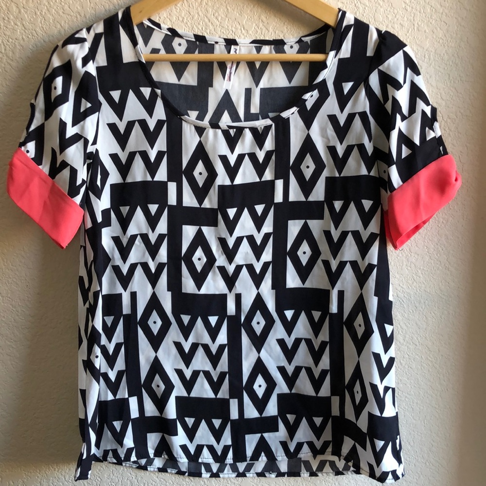 Black and White geometric print blouse with pink sleeve cuff accent, size Small